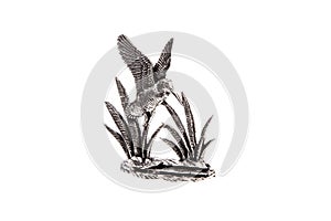 Silver statuette of a soaring bird isolated on white