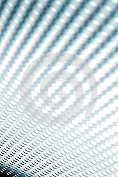 Silver-steel mesh background.