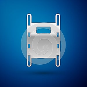 Silver Stretcher icon isolated on blue background. Patient hospital medical stretcher. Vector Illustration