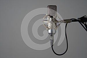 Silver studio condenser microphone on stand