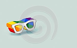 Silver sunglasses with rainbow outline inside. It`s OK to be gay concept.  on pastel green background with copy space. 3D