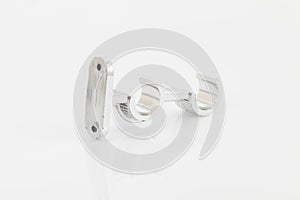 Silver support for curtain poles on white background