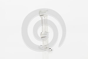 Silver support for curtain poles on white background