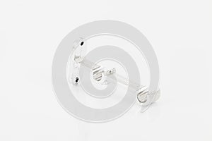 Silver support for curtain poles on white background