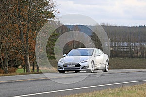 Silver Tesla Model S Electric Car On the Road