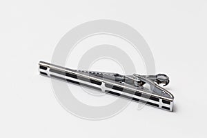 Silver tiepin on white background