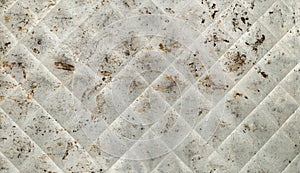 A Silver Tin and Flat Background with rust stains, scratches and diagonal lines.  It`s a horizontal photo with an overhead view.