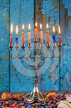 Silver traditional Hanukkah candles all candle lite on the menorah