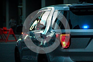 Silver unmarked police vehicle in downtown Calgary during a protest in Canada