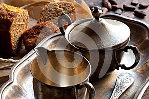 Silver utensil, bread and cocoa