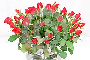 Silver vase with bunch of red roses 2