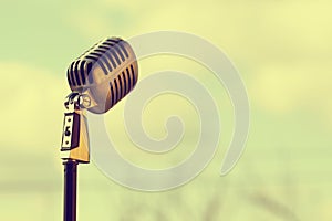 Silver vintage microphone in the studio on outdoor background