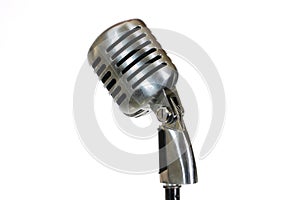 Silver vintage microphone in the studio on white background