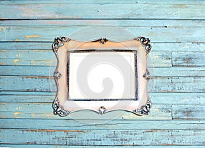 Silver Vintage picture frame on blue wood