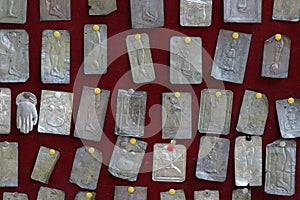 Silver votive offerings to Our Lady in the Shrine of Our Lady of Carsko polje in Cara, Croatia photo