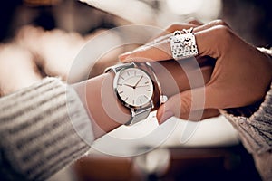 Silver watch on woman hand