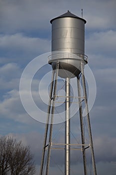 Silver water tower and blue sky