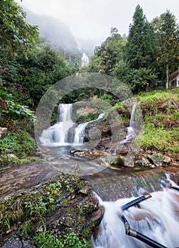 Silver waterfall or Thac Bac on fog in rainy season