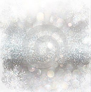 Silver and white bokeh defocused lights with snowflake overlay . abstract background.