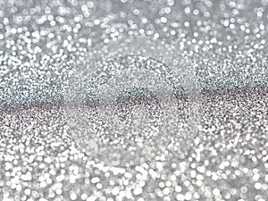 silver and white bokeh lights defocused. christmas abstract background