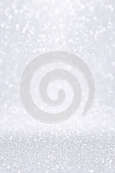 Silver white glitter snow background for Christmas or anniversary bokeh