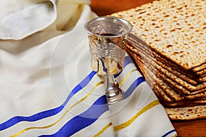 Silver wine cup with matzah, Jewish symbols for the Passover Pesach holiday.