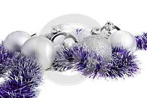 Silver Xmas balls and purple tinsel