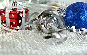 Silver xmas ornaments on bright holiday background with space for text. Merry christmas! Happu New Year.