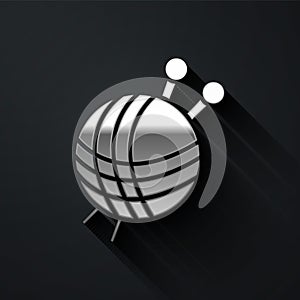 Silver Yarn ball with knitting needles icon isolated on black background. Label for hand made, knitting or tailor shop