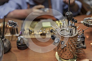 Silversmith working in an artisanal silversmith workshop in Florence, Italy