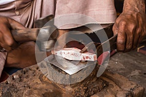 Silversmith at workshop creating silver jewlery