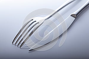 Silverware fork, knife on white table
