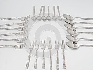 Silverware forks spoons knives cutlery on a white background