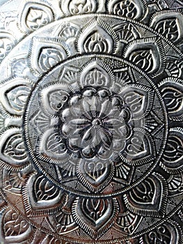 Silverware with lotus pattern background texture. photo