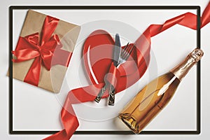 silverware, red and gold colored forks and spoons on a table