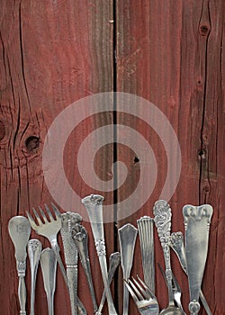 Silverware on red wooden table-vertical