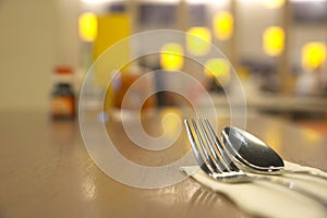 Silverware on top of wooden table