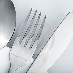 Silverware on white table