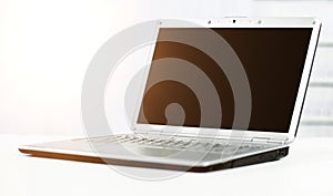 Silvery laptop at modern office