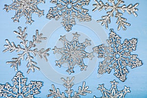 Silvery snowflakes on a blue background