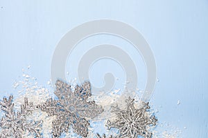 Silvery snowflakes on a blue background