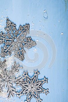 Silvery snowflakes on a blue background