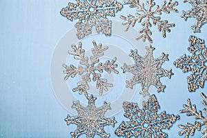 Silvery snowflakes on a blue background