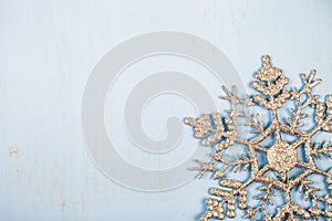 Silvery snowflakes on a wooden background.