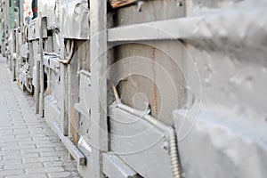 Silvery texture in steampunk style, cyberpunk bent, twisted, old metal sheets of tin, bolts, rivets, iron rods. The background