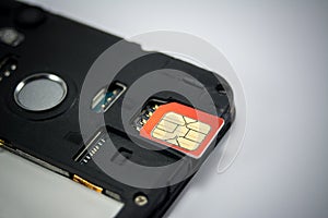 SIM card close-up next to the connector in the smartphone