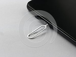 Sim card tray remover eject pin key tool and smartphone