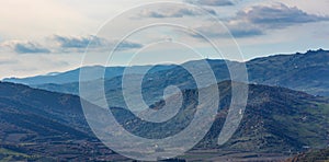 Simeto river valley panorama with surrounding mountains on slope of Mount Etna in Bronte town in Catania region of Sicily in Italy