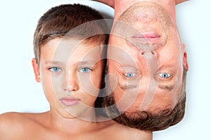 Similarity of father and son, young and old faces photo