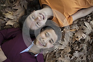 Similing children faces in the leaves